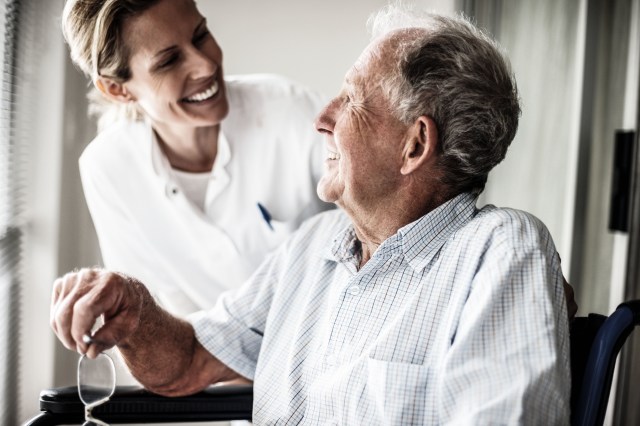 Nurse with smiling elderly man